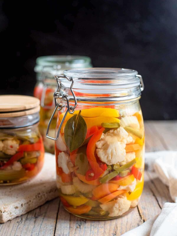 A close up of a jar of pickled vegetables